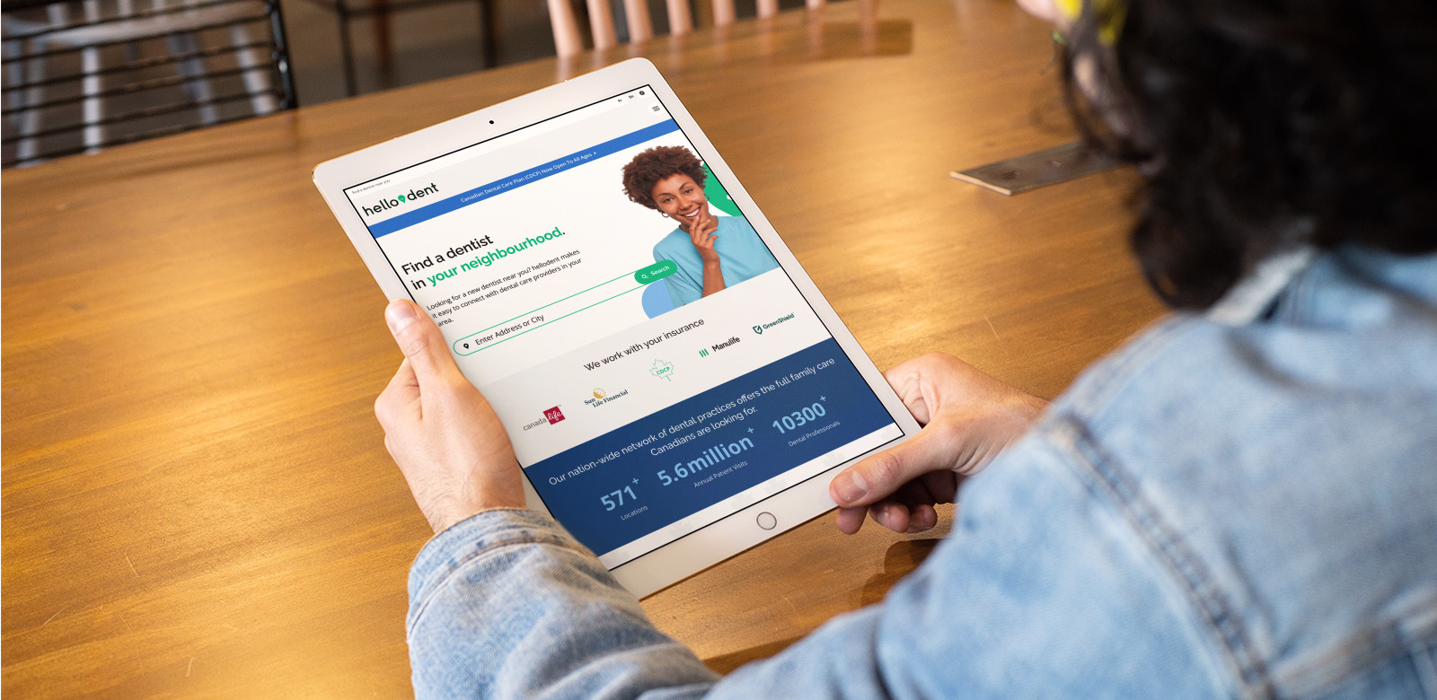 A tablet screen shows the hellodent website, which is hosted on Tymbrel.